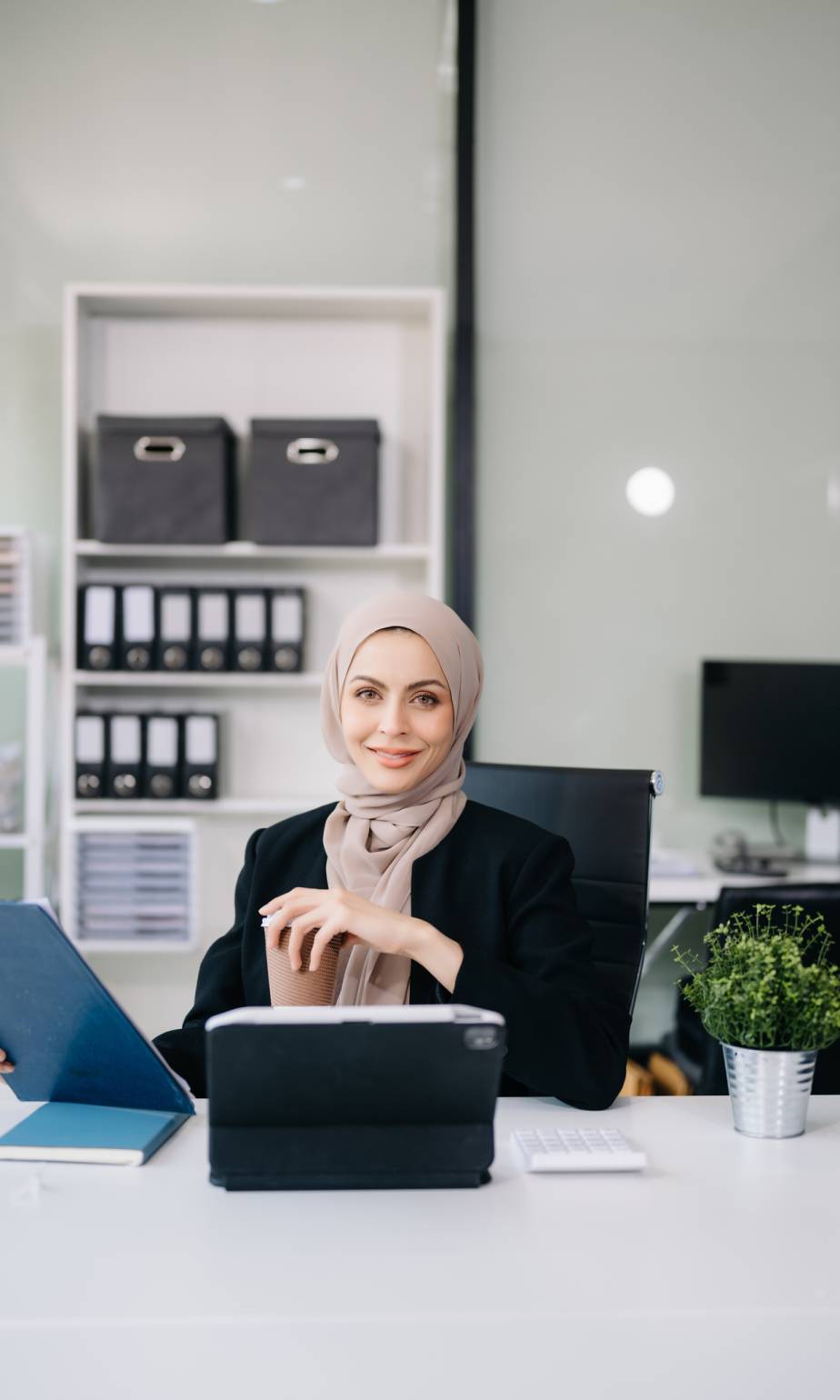 Successful Businesswoman Analyzing Finance on Tablet and Laptop at modern Office Desk tax, report, accounting, statistics, and analytical research concept